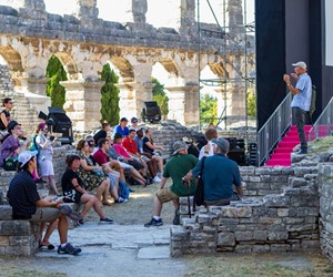 Silver tour visiting Roman amphitheater  in Pula, Croatia