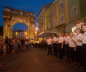 Silver tour performing in front of Arch of the Sergii, Pula, Croatia