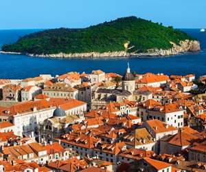 Dubrovnik roofscape with island of Lokrum in the background, Croatia